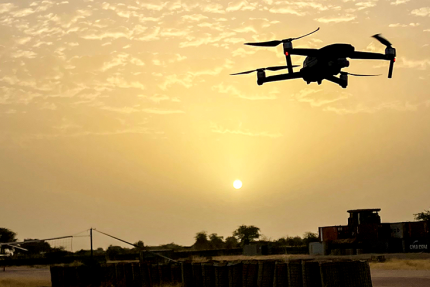 Drone flying over Mali at night